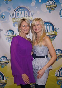 The 2 country female band members on the 2012 CMA Music Festival red carpet