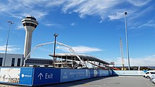 Metal frame of the station's walls and roof with a concrete pouring crane in front