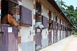 Traditional exterior-door stalls built in a row and facing a courtyard