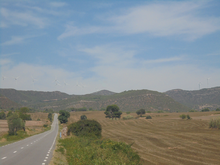 Mountains, seen from the side of a road