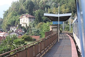 Looking out from a train window at a single side platform