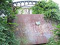 This 2007 photograph shows a steel plate across the east portal of the Schell bridge. A similar one is on the west portal, since the bridge deck is rusting through. The top of the plate reads "Where the sidewalk ends." The plate has a "NO TRESPASSING" sign bolted to it as well.