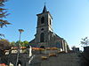 Kerk Notre-Dame de l'Assomption en de muur die de begraafplaats omgeeft, met uitzondering van het deel langs de monumentale trap, te Tintigny