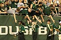 HOT members shake hands with fellow students after halftime.