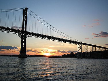 The Mount Hope Bridge is a two-lane suspension bridge spanning the Mount Hope Bay in eastern Rhode Island, at one of the narrowest gaps in Narragansett Bay. The bridge connects the Rhode Island towns of Portsmouth and Bristol, and is part of Route 114.