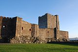 Carrickfergus Castle is a 12th-century Norman castle in on the shore of Belfast Lough. Besieged by Scots, Irish, English and French, the castle has long played an important military role in the history of Ireland