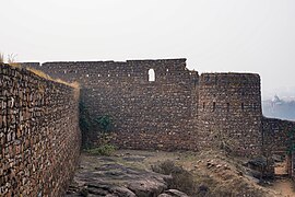 Inside south-west part, tower overlooking the ravine, loopholes near the top of the wall