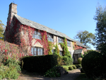 Upcott Barton Farmhouse including adjoining Front Garden Walls and Gate-piers to North-west and South-west