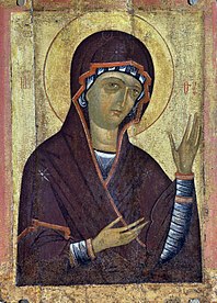 Meryem'in ellerini göğe doğru açarak dua eder hâlde sahnelendiği tipik bir agiosoritisa tasviri.
