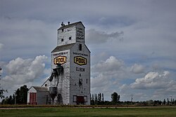 Grain elevator in Elbow, Note: original Saskatchewan Wheat Pool logo