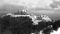 The Echo Mountain Promontory (ca. 1896) after a snowfall, and the White City resort of the Mount Lowe Railway as seen from a higher spot on the ridge and overlooking Altadena, CA. Buildings viewed from left to right: The Echo Chalet, Echo Mountain House, Incline Powerhouse, Dormitories, and Car Barn. Behind the car barn, note an inflatable reservoir for the storage of hydrogen gas produced in Pasadena and piped some 8.5 miles (13.7 km) to Echo. Echo Mountain is also known for its incredible echoes.