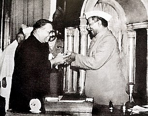 Dr. Babasaheb Ambedkar, chairman of the Drafting Committee, presenting the final draft of the Indian Constitution to Dr. Rajendra Prasad, President of constituent assembly on 25 November 1949.