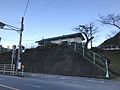 A view of the station building on the side hill cutting above National Route 386.