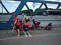A recumbent two-wheeled Trets trailer bike on the back of a tandem