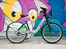 Bixi bike in front of a Montreal mural