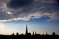 a silhouette of Riga's skyline