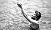 A devout dips in the water of Narmada in Kenud pond (Punasa Lift Irrigation Scheme BR-2 Kenud Pond)