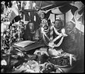 Roald Amundsen and crew on the Gjøa celebrating Christmas in Gjoa Haven in Nunavut, Canada in 1903 during the trip to the Northwest Passage. Helmer Hanssen, Amundsen, Lindstrøm, Gustav Wiik, and Anton Lund are seated at the table, and Peder Ristvedt is standing behind them.