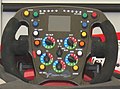 Yellow button marked "over" on the top left side of a 2008 Formula 1 steering wheel Toyota