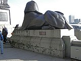 One of two sphinxes at the base of London's Cleopatra's Needle. The scars on the pedestal were from fragments of a bomb dropped during a World War II airstrike.