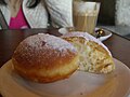 Custard-filled doughnut served by Il Fornaio, St Kilda, Victoria, Australia