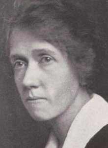 A yearbook photograph of a middle-aged white woman wearing a large white collar; she is not smiling