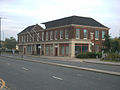 AVDC's Exchange Street Offices. This building's original use was industrial – it was where the electricity board was based with its showrooms (main building) and out the back was the power station. Construction was completed in 1931.