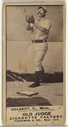 Standing man in baseball uniform