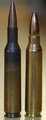 XL1E1 cartridge on the left and a .223 Remington cartridge on the right