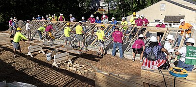 Walls being raised on a home site.