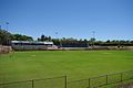 Litis Stadium Looking across the ground, the stadium on the left is the club rooms for FAFC, the stand on the right was built for the 1962 British Empire and Commonwealth Games the banked area is where the track was