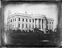 A black and white image of the White House