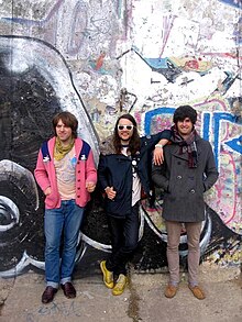 From left to right: Scott Yoder, Stefan Rubicz, Brendhan Bowers in front of the Berlin Wall