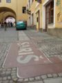 Šariš Brewery logo on the sidewalk in Prešov