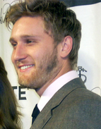 Aaron Staton smiles to the left