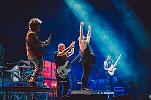 Atreyu performing in 2022. From left to right: Kyle Rosa, Dan Jacobs, Marc McKnight, Brandon Saller, and Travis Miguel.