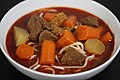 Bò kho with carrots, radishes, beef intestines and mì