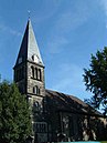 St.-Nikolai-Kirche mit Resten des alten Friedhofs und Mauer, Sackmann-Denkmal