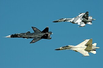 Sukhoi Su-47 Berkut in the lead, followed by a Su-27SKM (top) and a Su-30MKK (bottom).