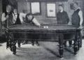 German billiards player Paul Kerkau, shooting on a rare billiards table in the shape of an elongated octagon, ca. 1920