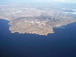 Aerial view of the entire peninsula with its hills, looking NNE toward the city of Los Angeles