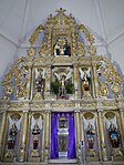 18th century altarpiece featuring the seven archangels and a tableau of the Holy Family