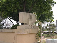 A planter with hollyhock motifs