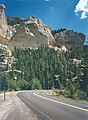 The road reveals rugged white cliffs and thick forest stands on the way from Parowan at the Brian Head-Panguitch Lake National Scenic Byway