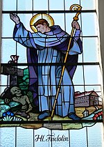 Stain glass image of Saint Fridolin, Andelsbuch Pfarrkirche