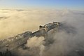 The bridge shrouded in a cool winter sunrise fog.