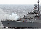 ARA Robinson fires her 3-inch gun during a surface gunnery exercise