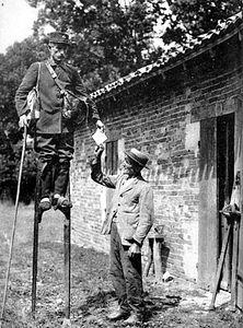 Mailman in Pays de Buch utilizing stilts ca. 1900