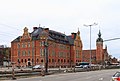 Centralhotel mit Bahnhofsgebäude rechts im Hintergrund