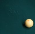 An example of the kinds of marks that shooting massé shots can leave on the billiard table's baize. Oh, and there's a cue ball, of course.